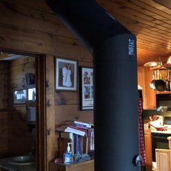 Tim's Top Hat Chimney Sweep & Service - Double wall pipe with 45 degree elbow and distancing from a combustible