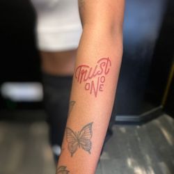 Hammersmith Tattoo - TRUST NO ONE Script Tattoo done at Hammersmith Tattoo London