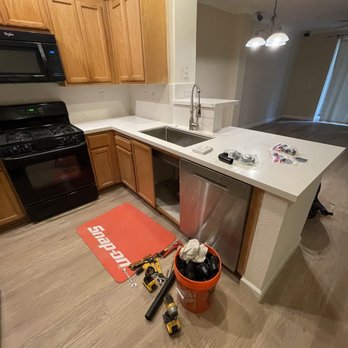 TSP Remodeling - Installing new kitchen sink faucet - General Contractors Near Me - Brentwood, California TSP Remodeling - Installing new kitchen sink faucet - General Contractors Near Me - Brentwood, California
