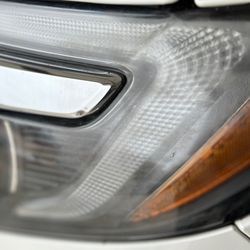 All Pro Auto Detailing - BEFORE- somewhat difficult to truly capture in a photo but you can see how cloudy and dingy the headlight was.