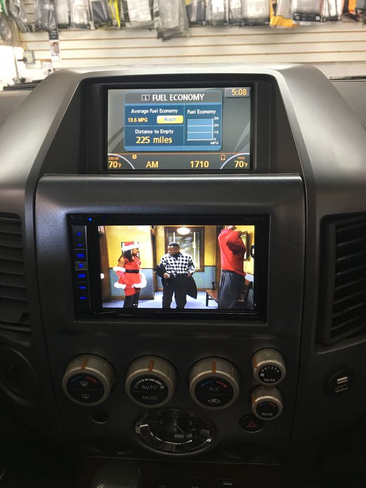 Nissan Armada with Pioneer Double Din & factory information screen