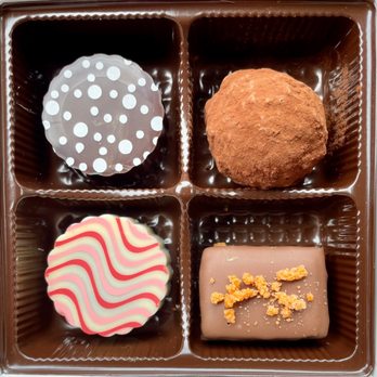 Stargazer Fine Chocolates and Coffee - From top left to right (to the bottom right): Mimosa, Death Star, Passion Rum, and Orange Habanero - Chocolatiers & Shops Near Me - Denver, Colorado Stargazer Fine Chocolates and Coffee - From top left to right (to the bottom right): Mimosa, Death Star, Passion Rum, and Orange Habanero - Chocolatiers & Shops Near Me - Denver, Colorado