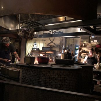 Maydan - Seated at the bar, you can see the food being cooked over the fire and some of the kitchen action. - Moroccan Near Me - Washington, DC, District of Columbia Maydan - Seated at the bar, you can see the food being cooked over the fire and some of the kitchen action. - Moroccan Near Me - Washington, DC, District of Columbia