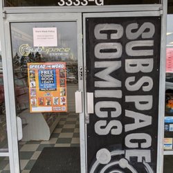 Subspace Comics - Embracing the broken glass with a hand painted sign.