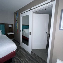 Hampton Inn & Suites Chico - Barn door separates the bathroom.