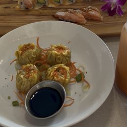 Steamed pork dumplings and Hot girl roll sushi Steamed pork dumplings and Hot girl roll sushi