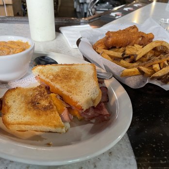 Miller's Crossing - a sandwich and fries on a plate - Bars Near Me - Helena, Montana Miller's Crossing - a sandwich and fries on a plate - Bars Near Me - Helena, Montana