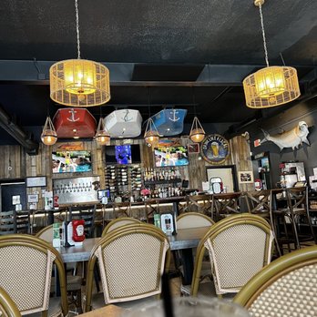 Hog Island Fish Camp - tables and chairs in a restaurant - Seafood Near Me - Dunedin, Florida