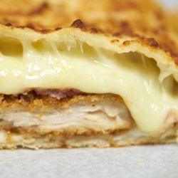 Pizzadoro's - Chicken Cordon Bleu Calzone. Fresh chicken cutlet, prosciutto, swiss, and copious amounts of cheese.