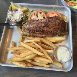 Blackened Grouper sandwich with fries & a side of veggies of the day. Fresh & clean Blackened Grouper sandwich with fries & a side of veggies of the day. Fresh & clean