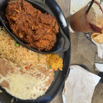 Tequila Jack's - Chile Colorado (spicy) plate that comes with rice, beans, corn pudding and tortillas   Tamarindo Margarita on the side - Bars Near Me - Long Beach, California