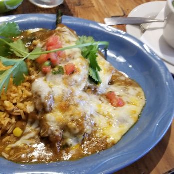 Taquilo's - Flavorful Pollo Poblano Plate. Chicken tinga (seasoned shredded chicken) stuffed poblano covered in tasty sauce & cheese. Very filling. - Mexican Near Me - Galveston, Texas