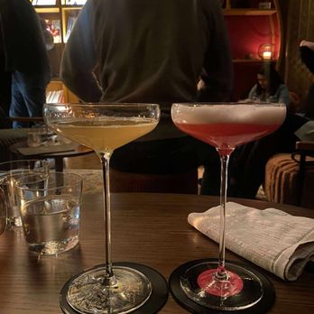 Bar Crenn - The one on the left (yellow) is their classic sour and the one on the right (pink) is their signature sour with huckleberry - Wine Bars Near Me - San Francisco, California Bar Crenn - The one on the left (yellow) is their classic sour and the one on the right (pink) is their signature sour with huckleberry - Wine Bars Near Me - San Francisco, California