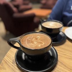 Crema Coffee + Bakery - Spiced mocha (background: regular mocha)