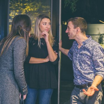 In Realty - Justin Green (Broker) chatting with clients during a company sponsored Art Event - Real Estate Services Near Me - Dorchester, Massachusetts