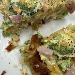 Broccoli and cheddar omelette with ham, hashbrowns well done and inside.