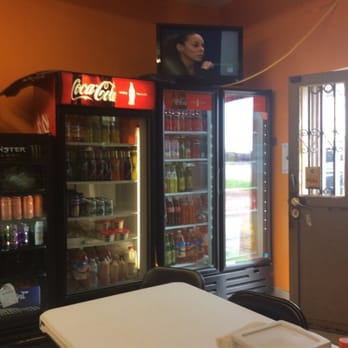 Panaderia Canaan - a table and a television - Bakeries Near Me - Dodge City, Kansas Panaderia Canaan - a table and a television - Bakeries Near Me - Dodge City, Kansas