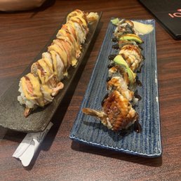 two plates of sushi on a table