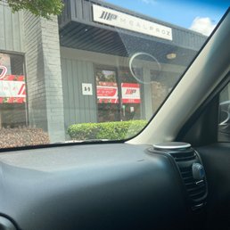 a view of a restaurant from inside a car