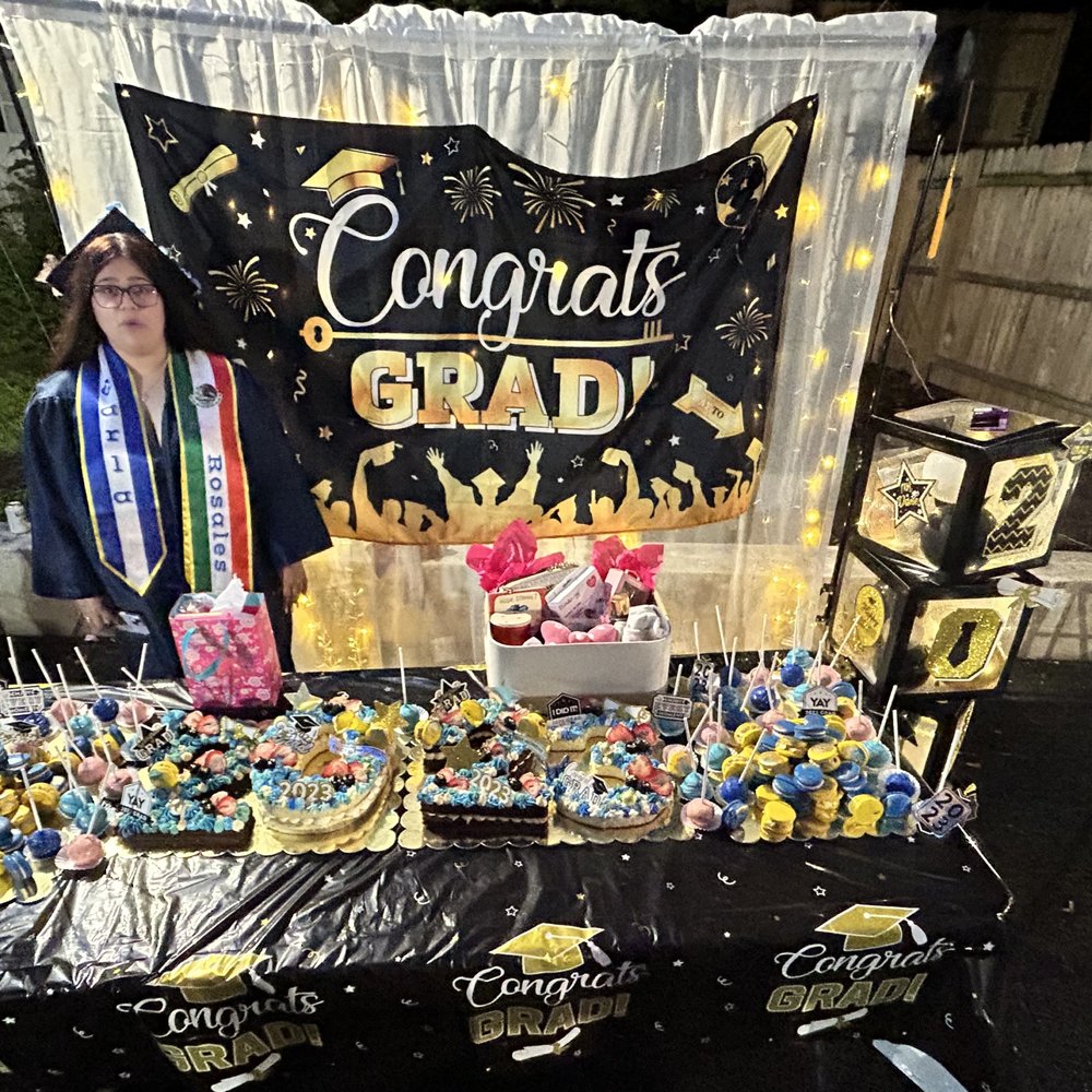Beck's Blissful Bites - a woman standing in front of a graduation table - Bakeries Near Me