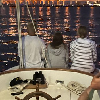 Treasure Coast Sailing Adventures - Grandkids watching fireworks from stern - Boat Charters Near Me - Stuart, Florida Treasure Coast Sailing Adventures - Grandkids watching fireworks from stern - Boat Charters Near Me - Stuart, Florida