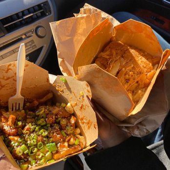 Poutine Centrale - La Pulled Pork (on the right) and La General Tao (on the left) poutine. - Poutineries Near Me - Montreal, Quebec