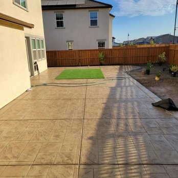 A &E Landscaping - a concrete patio with artificial grass - Artificial Turf Near Me A &E Landscaping - a concrete patio with artificial grass - Artificial Turf Near Me
