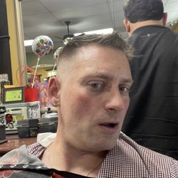 Checking out my awesome fade and short Caesar cut top