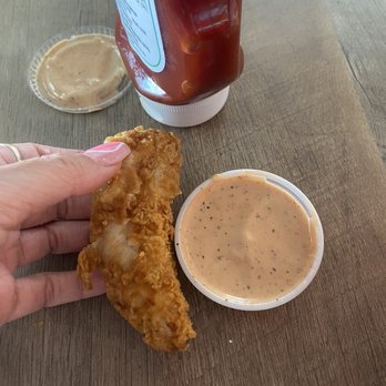 Raising Cane's Chicken Fingers - A rip off piece of tender - Fast Food Near Me - Tempe, Arizona