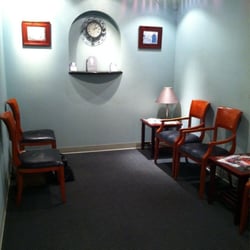 Lori Lucia, LMFT - Small yet cozy waiting area with 6 large chairs for seating.