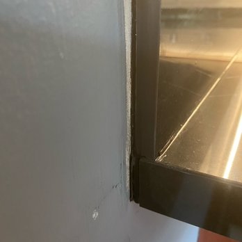 Porcelanosa - Terrible corner - they just tried to fix with epoxy. - Kitchen & Bath Near Me - Chicago, Illinois