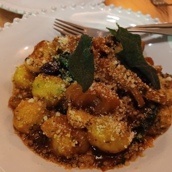 Cucciolo Terrazza - Lamb with Gnudi, olives, onions, kale in a rich sauce - Italian Near Me - Raleigh, North Carolina Cucciolo Terrazza - Lamb with Gnudi, olives, onions, kale in a rich sauce - Italian Near Me - Raleigh, North Carolina