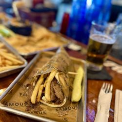 The Famous Restaurant - Gyro with fries and pickle.