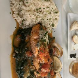 Salmon over spinach, clams, risotto