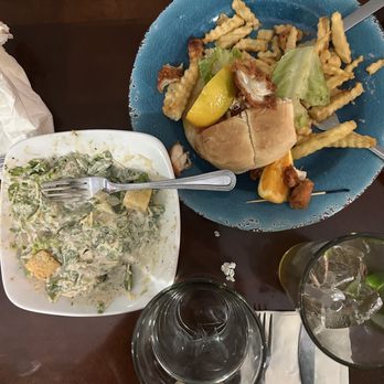 Uptown Korrna Kitchen - drenched caesar salad, over fried chicken sandwich - Salad Near Me - Martinsville, Virginia