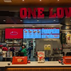 Raising Cane's Chicken Fingers - Some decor as well as the menu and service counter.