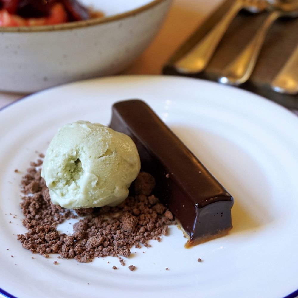 Acorn Vegetarian Kitchen - Dark chocolate and salted caramel tart, mint ice cream (£8.25). - Vegetarian Near Me - Bath, BAS Acorn Vegetarian Kitchen - Dark chocolate and salted caramel tart, mint ice cream (£8.25). - Vegetarian Near Me - Bath, BAS