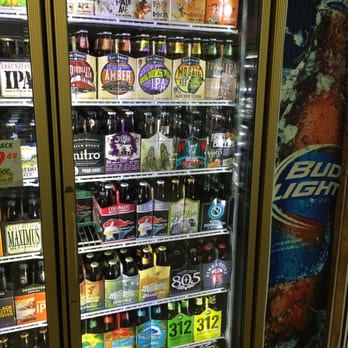 Bottle Rack - a variety of beer in a refrigerator - Beer, Wine & Spirits Near Me - La Mesa, California