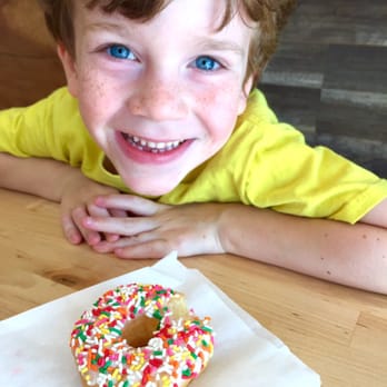 Donut House - Little guy couldn't wait to eat his donut, so no picture of its pristine glaze and abundance of sprinkles. - Donuts Near Me - Irving, Texas Donut House - Little guy couldn't wait to eat his donut, so no picture of its pristine glaze and abundance of sprinkles. - Donuts Near Me - Irving, Texas