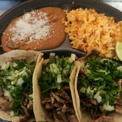 El Gran Taco Loco in Wickenburg - A delicious filling plate with 3 carne asada tacos and rice and beans, topped with cilantro and onion
