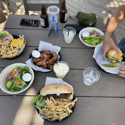 Harbor Reef Restaurant - Top L, clockwise: Cheeseburger and fries, wings, garden salad, cheeseburger, club sandwich, another garden salad.