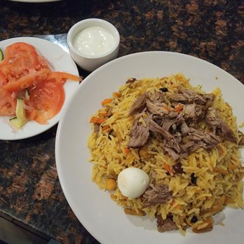 OSH Restaurant & Grill - Osh _ braised lamb with rice and carrots. Achichuk salad on side - Mediterranean Near Me - Nashville, Tennessee