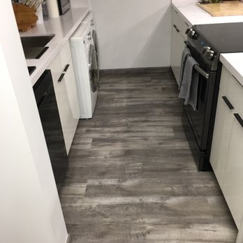 H & C Flooring and Stone - a kitchen with a washer and dryer - Flooring Near Me - Honolulu, Hawaii H & C Flooring and Stone - a kitchen with a washer and dryer - Flooring Near Me - Honolulu, Hawaii