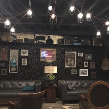 Saint Anejo - Upstairs bar lounge seating. - Cocktail Bars Near Me - Nashville, Tennessee