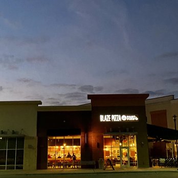 Blaze Pizza - the outside of a restaurant at night - Salad Near Me - Holly Springs, North Carolina