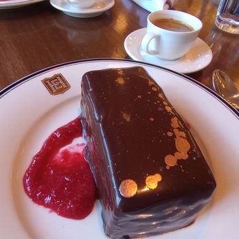 Supper - Gold Rush - get this!!!! Decadent chocolate cake with chocolate espresso ganache, gold leaf & cherry compote. - New American Near Me - San Antonio, Texas Supper - Gold Rush - get this!!!! Decadent chocolate cake with chocolate espresso ganache, gold leaf & cherry compote. - New American Near Me - San Antonio, Texas
