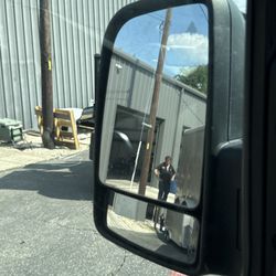 Big Tex Trailer World Buda - My side mirror showing them fixing my trailer