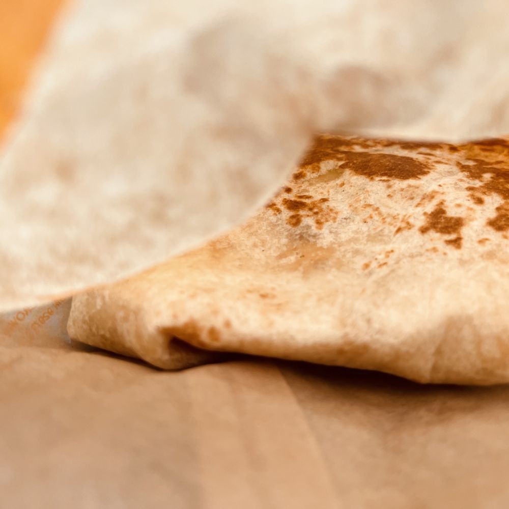 Taco Bell - a piece of bread on a table - Fast Food Near Me - Hudson, Wisconsin