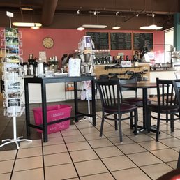 Counter of coffee shop with tables