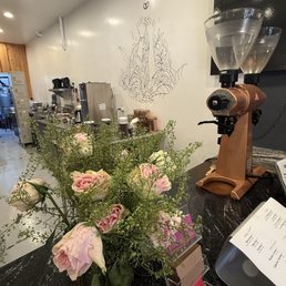It's an adorable small coffee shop. I loved the touch of fresh flowers. It's an adorable small coffee shop. I loved the touch of fresh flowers.